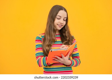 Schoolgirl With Copy Book Posing On Isolated Background. Literature Lesson, Grammar School. Intellectual Child Reader.