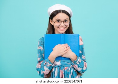 Schoolgirl With Copy Book Posing On Isolated Background. Literature Lesson, Grammar School. Intellectual Child Reader. Happy Teenager, Positive And Smiling Emotions.