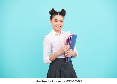 Schoolgirl With Copy Book Posing On Isolated Background. Literature Lesson, Grammar School. Intellectual Child Reader. Happy Teenager, Positive And Smiling Emotions Of Teen Girl.