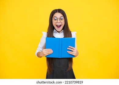 Schoolgirl With Copy Book Posing On Isolated Background. Literature Lesson, Grammar School. Intellectual Child Reader. Excited Face, Cheerful Emotions Of Teenager Girl.