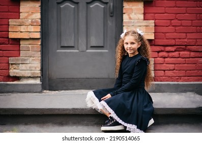 Schoolgirl At The Door Of The School. The First Bell. End Of The School Year. Hunger For Knowledge. Farewell Bell. First Day At School. Copy Space