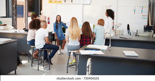 Schoolgirl Presenting Project In Front Of Science Class