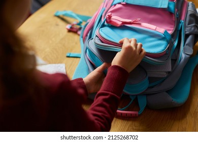 Schoolgirl Put Books And Notes Into Backpack At Home, Pupil Prepare Staff For Education, School Supplies, Back To School Concept.