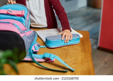 Schoolgirl Put Books And Notes Into Backpack At Home, Pupil Prepare Staff For Education, School Supplies, Back To School Concept.