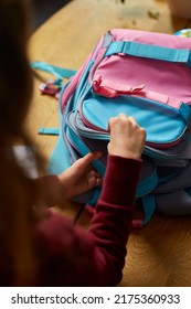 Schoolgirl Put Books And Notes Into Backpack At Home, Pupil Prepare Staff For Education, School Supplies, Back To School Concept.