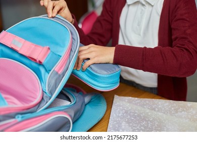 Schoolgirl Put Books And Notes Into Backpack At Home, Pupil Prepare Staff For Education, School Supplies, Back To School Concept.