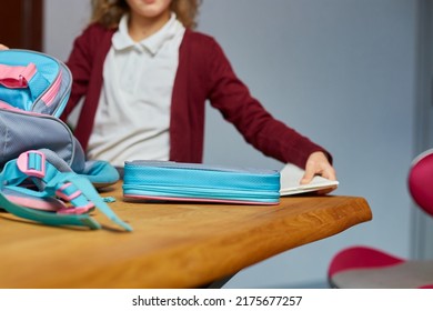 Schoolgirl Put Books And Notes Into Backpack At Home, Pupil Prepare Staff For Education, School Supplies, Back To School Concept.