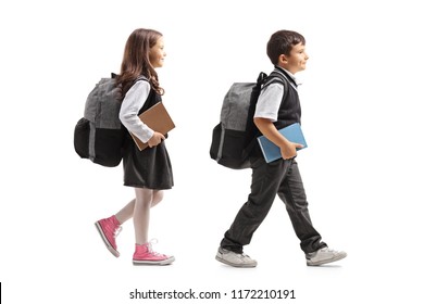 Schoolgirl and schoolboy with backpacks walking  isolated on white background