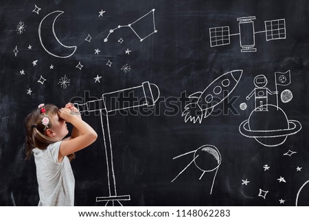 Schoolgirl standing in front of a blackboard, watching stars through a chalk-drawn telescope, learning about space and astronomy