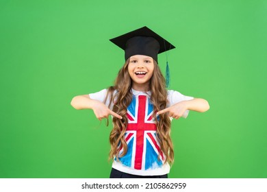 A Schoolgirl In A T-shirt With An Image Of The English Flag. A Graduate In A Ceremonial Hat. Getting An Education Abroad. Teaching English.