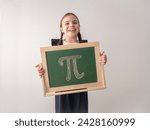 A schoolgirl in uniform holds a chalkboard with the number Pi written on it. A little girl with pigtails is smiling. The concept of the international Pi Day holiday.