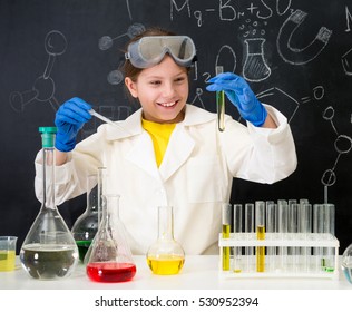 schoolgirl in white gown doing experiments with liquids in chemistry lab - Powered by Shutterstock