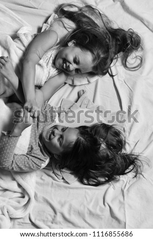 Similar – Image, Stock Photo Relaxed mother and sons embracing lying in the bed