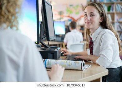 Schoolgirls In Private School Uniform Using Computers In The Computer Lab