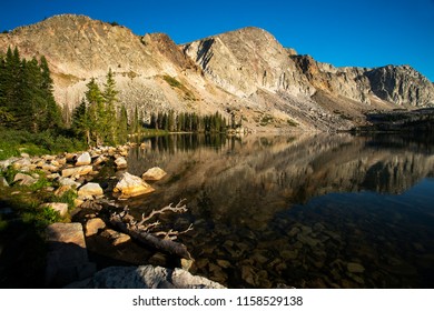 Schoolhouse Rock And The Diamond Reflected In Lake Marie In Medicine Bow National Forest In Wyoming.
