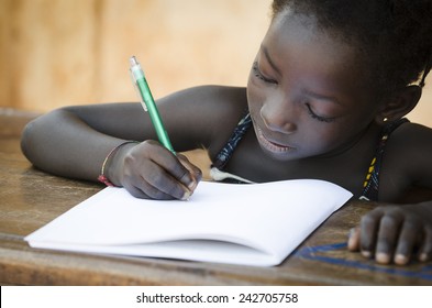 Schooling Symbol - African Young Girl Writing Notes (Real People)