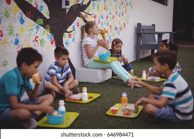 Schoolkids having meal in school - Powered by Shutterstock