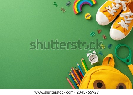 Schooltime essentials in focus: Top-view shot capturing a green blackboard setting adorned with delightful school stationery, a kid's school bag and shoes. Great for educational themes