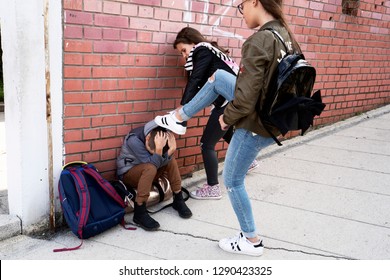 Schoolyard bullies, concept of this taking place after school,Aggressive te...