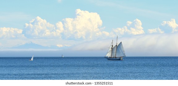 Schooner, Fog, And Puffy Clouds