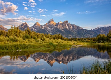 Schwabacher's Landing, Jackson Hole, Wyoming. The Grand Teton mountains are seen at dawn reflected in the still water of the Snake River.
