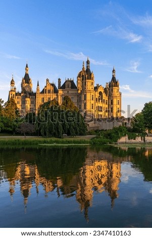 Schwerin Castle in the evening light and reflection in the lake, Schwerin, Mecklenburg-Western Pomerania, Germany