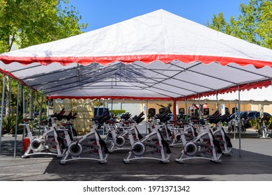 Schwinn Carbon Blue Spin Bikes Set Up Under Tent For An Outdoor Spinning Class. - San Jose California, USA - 2021