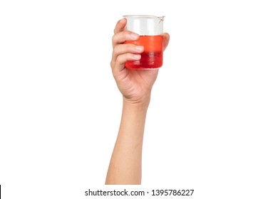 Science Beaker With Red Water Or Red Liquid Holding By Boy Hand Isolated On White Background. Hand Showing Science Beaker In Laboratory.