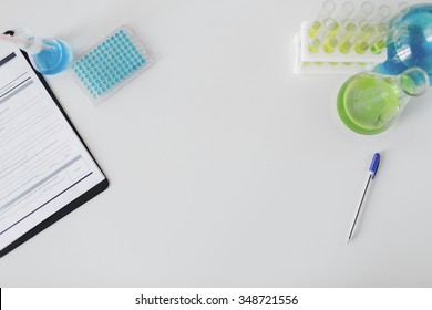 Science, Chemistry, Biology, Medicine And Advertisement Concept - Close Up Of Scientific Laboratory Table With Stuff