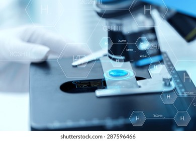 science, chemistry, biology, medicine and people concept - close up of scientist hand with test sample making research in clinical laboratory over hydrogen chemical formula