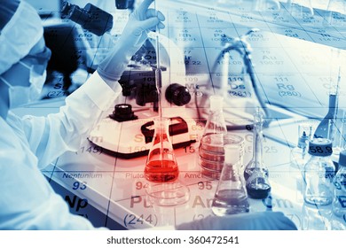 Science, chemistry, technology, biology and people concept - young female scientist mixing reagents from glass flasks and making test or research in clinical laboratory with chemical table background 