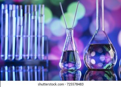 Science concept. Laboratory beakers. Colorful bokeh.