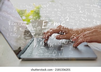 Science and education concept. Illustration of basic physics and mathematics formulas and woman working on laptop at table, closeup