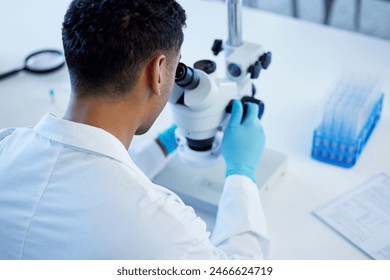 Science, exam and man with microscope, notes and medical research in laboratory. Vaccine innovation, scientist or lab technician for healthcare, medicine and pharmaceutical development in test tube.