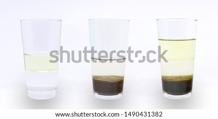 Science experiment: heterogeneous mixture of water, oil and sand; water and oil; water and sand.