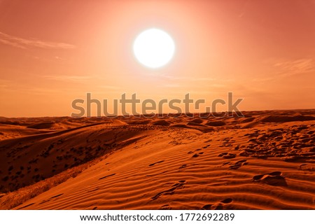 Science fiction landscape / fantasy landscape: sand dunes in front of an orange and burning sun, sand exoplanet, surreal landscape with a dominant orange, looks like Dune
