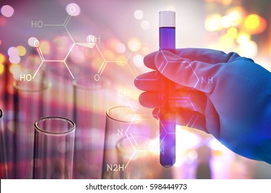 science hand holding laboratory test tubes , laboratory equipment , science background