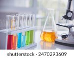 Science laboratory chemistry test science lab with microscope, glass tubes, chemical beaker white table scientific background. Colorful Liquid biology laboratory chemical fluid scientist experiment