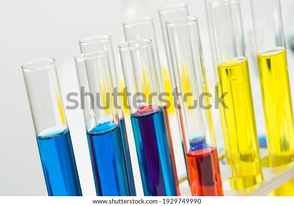 Science laboratory research and development.\
Close up test tubes with colorful substance on white background.\
Chemical manufacture concept with glass equipment. Modern\
biotechnology industry.