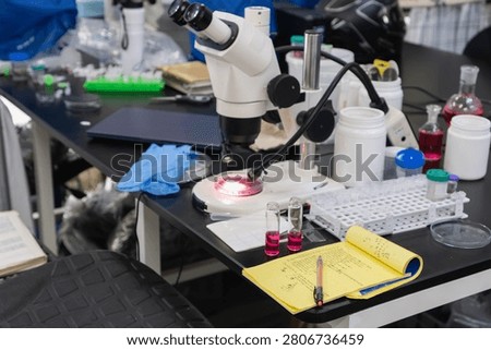 Science laboratory setup with equipment and notes for research and experiment