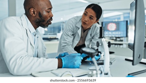 Science, people or tablet in lab for discussion, brainstorming or innovation for medicine development. Scientists, research team or tech at desk for learning, mentorship or virus vaccine engineering - Powered by Shutterstock