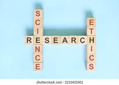 Science Research Ethics Concept. Crossword Puzzle Flat Lay Typography In Blue Background