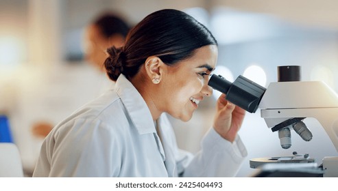 Science, research and happy woman with microscope, technology or biotech data in laboratory. Medical innovation, scientist or lab technician in study in healthcare, medicine or pharmaceutical future - Powered by Shutterstock