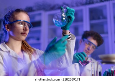 Science students doing chemical experiment in the laboratory at university. - Powered by Shutterstock