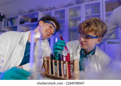 Science students doing chemical experiment in the laboratory at university. - Powered by Shutterstock