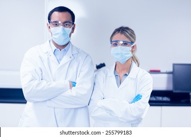 Science students wearing protective masks at the university - Shutterstock ID 255799183