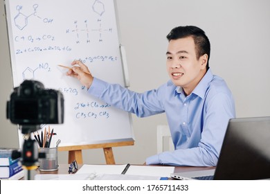 Science Teacher Drawing Chemical Formulas On Whiteboard When Hosting Online Lesson For College Students