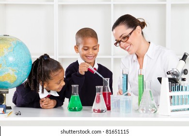 Science Teacher And Students In Lab