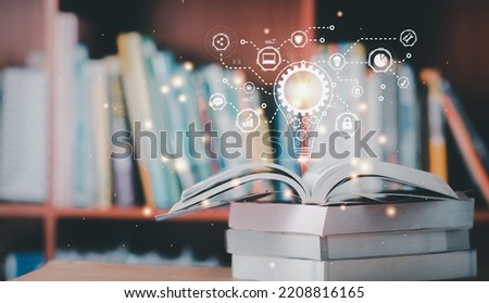 Science technology concept. Education technology.E-learning concept. Digital learning interface innovation.Book in library with open textbook, stack piles of literature text archive on reading desk