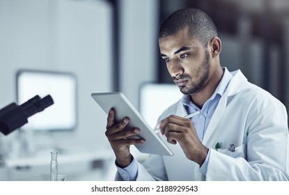 Science, Technology And Medical Research With A Male Scientist In The Scientific Innovation And Development Industry. Lab Technician Working On A Tablet, Making Breakthrough And Discover In Medicine